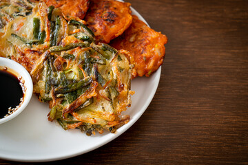 Pajeon or Korean pancake and Korean Kimchi pancake or Kimchijeon on white background