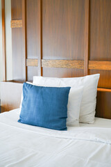 comfortable pillows and white pillows on bed