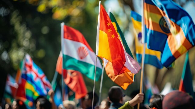 Colorful flags wave proudly as students from different cultural backgrounds march together in a parade celebrating their unity and diversity.