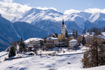 Alpine mountain panorama in winter.  Beautifully located mountain village of Ftan in Engadine,...
