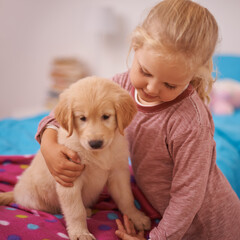 Girl, child and golden retriever with hug on bed for playing, bonding and protection in bedroom of home with love. Kid, puppy and dog for companion, affection and embrace with pet care in apartment