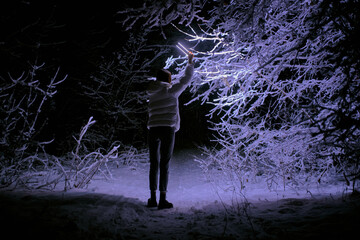 Person in the forest at night	