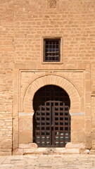 Fototapeta na wymiar Door off the inner courtyard from the Great Mosque of Kairouan, in Kairouan, Tunisia