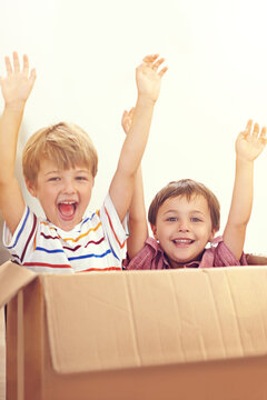 Box, Children Or Portrait Of Siblings Playing In House For Fun, Bonding Or Hands Up Game. Cardboard, Learning And Excited Kids In Living Room For Celebration, Imagine Or Rollercoaster Fantasy At Home