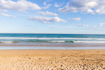 Fototapeta na wymiar Tranquil Seashore Embraced by Azure Skies and Gentle Tides