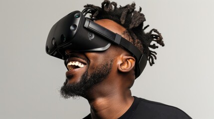 Smiling man on a white background while looking through a VR headset and making expressive gestures - obrazy, fototapety, plakaty