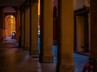 The street and arcade in the city centre in Bologna, Italy