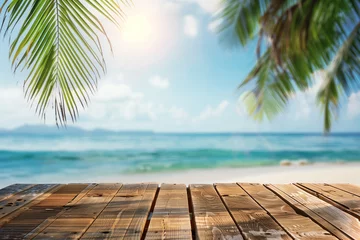 Foto op Plexiglas Top of wooden table with sea view and palm leaves Calm sea and sky at tropical beach background show off your products. summer vacation background concept © atitaph