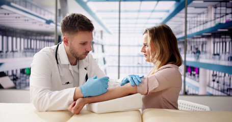 Patient Blood Draw By Doctor