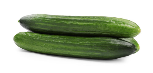 Many long fresh cucumbers isolated on white