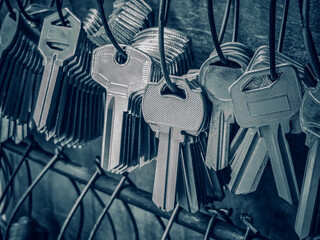 Many key chains for copy key on locksmith shop.