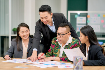 Asian business diverse team happy working together in meeting room for marketing plan.