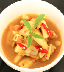 Top view. Selective focus. Cumi Rica Rica, squid cuisine with red and spicy sambal. Indonesian food.

