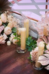 Decor for a wedding or engagement party. Candles in glass flasks