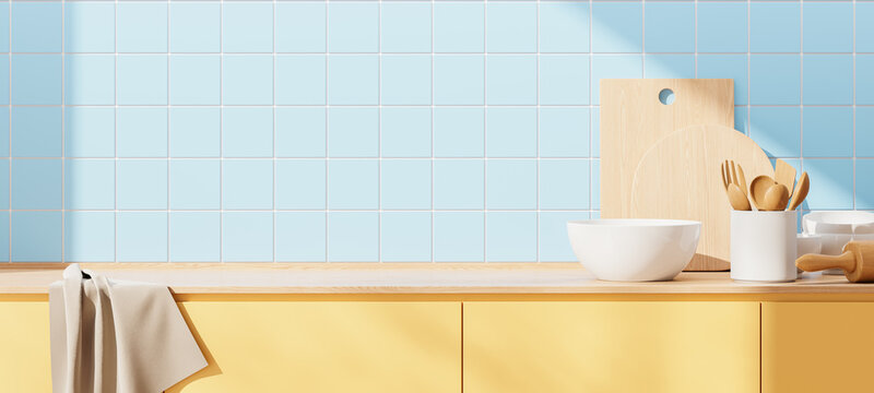 Blue tile home kitchen interior with counter and kitchenware, empty copy space