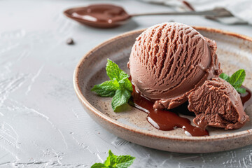 delicious Chocolate Gelatoa plate with a scoop of rich chocolate gelato garnished with mint leavesfor a styled food photography shoot minimalist background