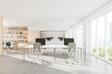 Cozy office interior with desk and armchairs in row, panoramic window