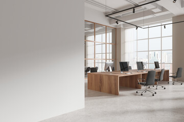 Fototapeta premium White and beige open space office corner with blank wall