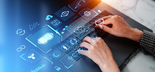 Woman with laptop developing VR program