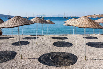 Stony beach with umrellas