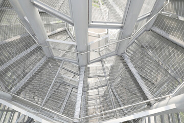 White steel frame structure with surrounding walls are lined with steel grids inside tha Bird Watch Tower at Pupha Mahanatee Garden in Queen Sirikit Park in the centre of Bangkok, Thailand.