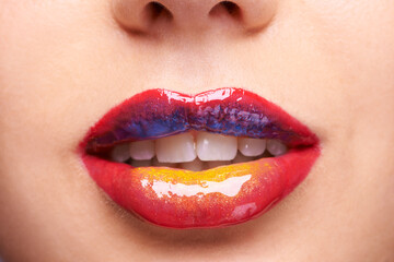 Obraz premium Lipstick, creative makeup and mouth of woman for luxury, wellness and products with colors. Salon aesthetic, cosmetology and closeup of lips of person with lip gloss, shine and cosmetics in studio