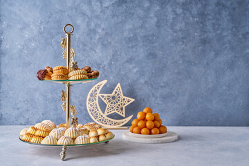 Assorted semolina maamoul or mamoul cookies , awameh or luqaimat with ramadan decor crescent moon - obrazy, fototapety, plakaty