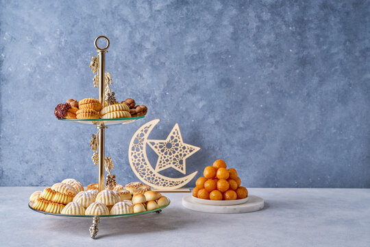 Assorted semolina maamoul or mamoul cookies , awameh or luqaimat with ramadan decor crescent moon