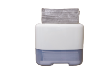 Holder or dispenser for paper towels on the wall tiles in a public toilet, isolated on a white background. Paper towel dispenser on the wall in the bathroom