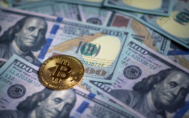 Bitcoin gold coins placed on a dollar bill, Concepts of investment,ETF, saving money , stock market, currency exchange, dividends, mutual funds for digital assets