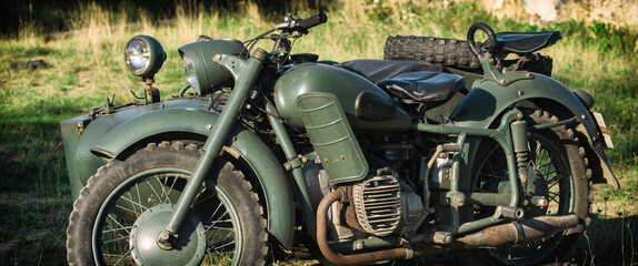 MILITARY MOTORCYCLE - An old Soviet machine in camouflage colors
