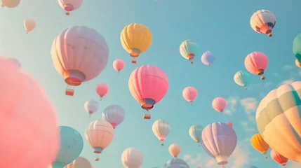 Foto auf Acrylglas Heißluftballon Many pastel-colored balloons fly upwards.