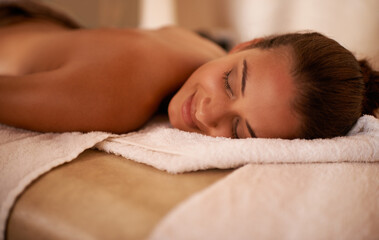 Peace, calm and woman in spa to relax for vitality or wellbeing, luxury and pamper for body care or...