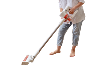 Woman with a wireless portable vacuum cleaner in the kitchen, isolated on a white background. Cleans the floor in an apartment with a vacuum cleaner with a battery