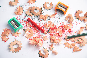 A pencil sharpener with a pencil and pencil shavings.