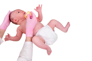 The doctor gives a pacifier to a newborn baby, isolated on a white background. Nurse in uniform soothes a crying baby. Kid aged two months