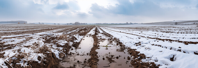 Winter agricultural field. Snow mud and puddles in spring. Banner slider horizontal template. - 754174604