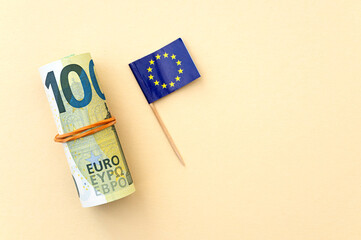 EURO currency with 100 euro note and flag of European union, concept political picture - 754179089