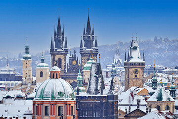 Snow in Prague, rare cold winter conditions. Prague Castle in Czech Republic, snowy weather with trees. City landscape from beautiful town. Winter travelling in Europe.