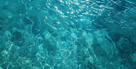 Fototapeta premium Crystal clear water top view background. Blue turquoise ripple