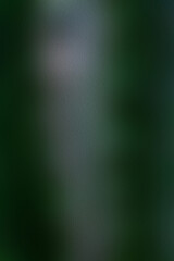 A blurr texture background of dark green to lighter green hues, giving it a mysterious and enigmatic aura