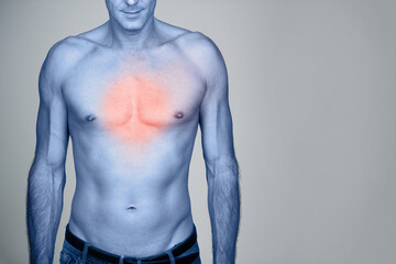 Medical, chest pain and man with heartburn in studio with inflammation, discomfort or injury. Red...