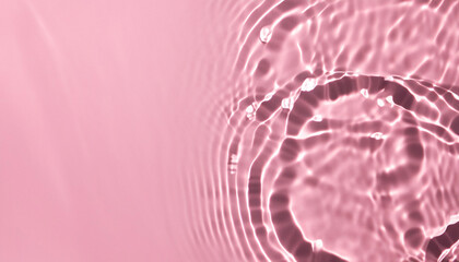 Abstract transparent water shadow surface texture natural ripple on pink background; creative stock photo image banner
