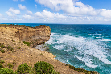 Fototapeta na wymiar Eternal Dance of Ocean and Cliff on Australia’s Coast, Great Ocean Road