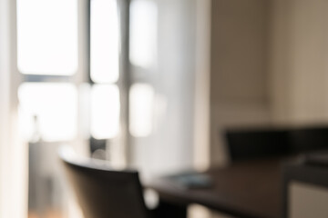 Blurred background of dining room with leather chair closeup