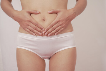 Close-up of woman wearing white panties On a white background about menstruation, cervical cancer,...