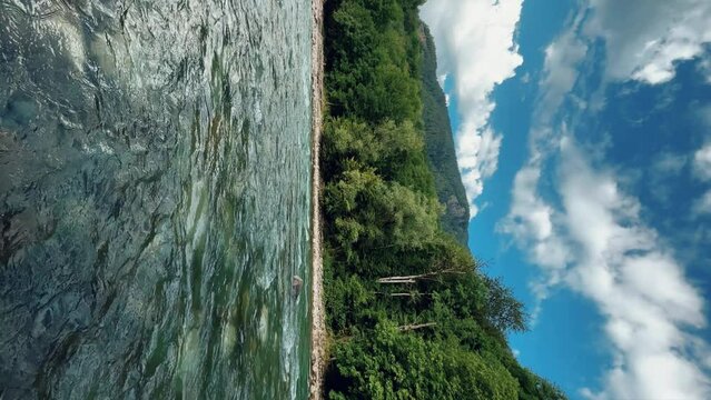 The Bolshaya Laba River. A mountain emerald river in a narrow, sunlit canyon. Bolshaya Laba River near the village of Psemen in Karachay-Cherkessia, Russia. Panoramic view. 4K