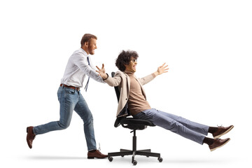 Office worker running and pushing a man on a desk chair