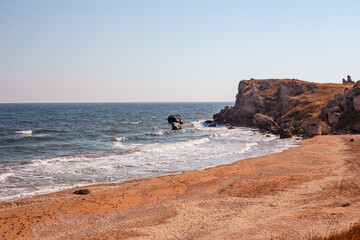 Fototapeta na wymiar Seascape. Rocky seashore with sandy beach. Crimea, General's beaches