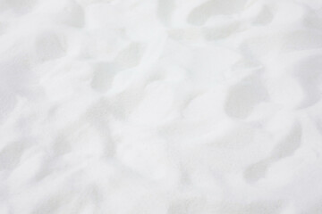 Soft blur abstract of white sand background.